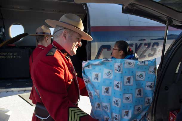 Unloading Toys in Landsdowne House  RCMP S/Sgt. Normand Roy