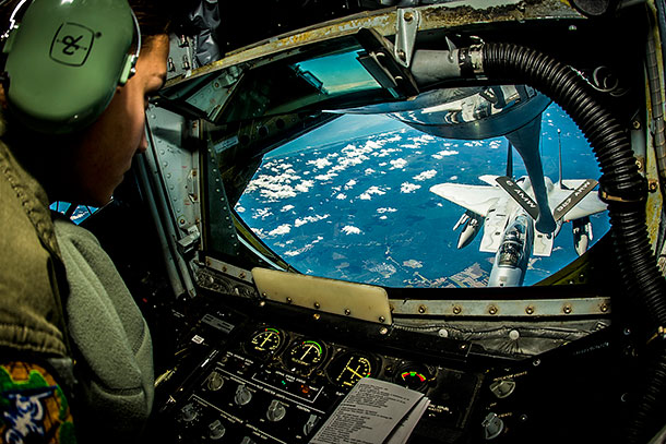 Air Force Senior Airman Crystal Cash refuels an F-15 during exercise Vigilant Shield 15 over the United States, Oct. 20, 2014. The annual exercise is designed to integrate Defense Department and civil response in support of the national strategy of aerospace warning and control, defense support of civil authorities and homeland defense. U.S. Air Force photo by Tech. Sgt. Brandon Shapiro
