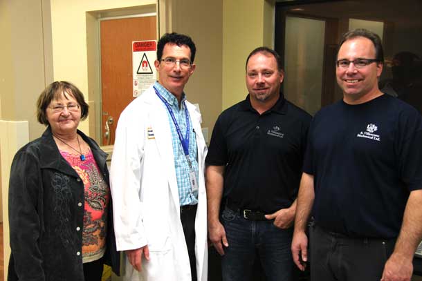 l-r Sandra, Jason and Jeff Villeneuve met with Dr. Mitchell Albert (2nd from left) to discuss his new research into imaging technology which will help in testing and evaluating lung disease treatments. $25,000 from the Anthony Villeneuve Memorial Endowment Fund was donated to the research project which was set up in honour of husband and father, Tony, who passed away from mesothelioma.