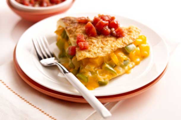 As if red and green peppers don't make this cheese-stuffed omelet colorful enough, it's also topped with thick and chunky salsa