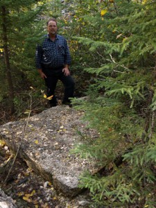 In this view on September 23, 2008, a concrete cap covers the old shaft.  Traces of the old mine include waste rock piles, a tailings area, and some concrete footings.  The site, near Onaman Lake, is accessed from the Kinghorn Road.  Edgar J. Lavoie photo.