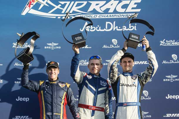 Matt Hall of Australia (L), Paul Bonhomme of Great Britain (C) and Pete McLeod of Canada (R) celebrate during the Award Ceremony of the first stage of the Red Bull Air Race World Championship in Abu Dhabi, United Arab Emirates on February 14, 2015. Photographer Credit Joerg Mitter / Red Bull Content Pool