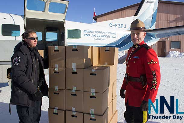 During the Toys for the North Trip, NAPS Officers and RCMP Officers unloaded water in Ogoki Post