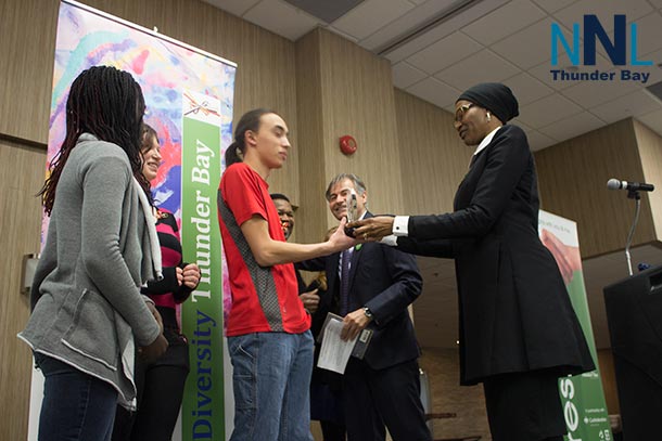 Shane Wong accepting the Respect Award on behalf of Regional Multicultural Youth Council.