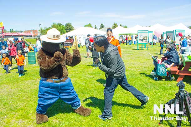 All in good fun, Smokey the Bear and Munzeroy clown for the camera... but seriously fighting forest fires is really important.