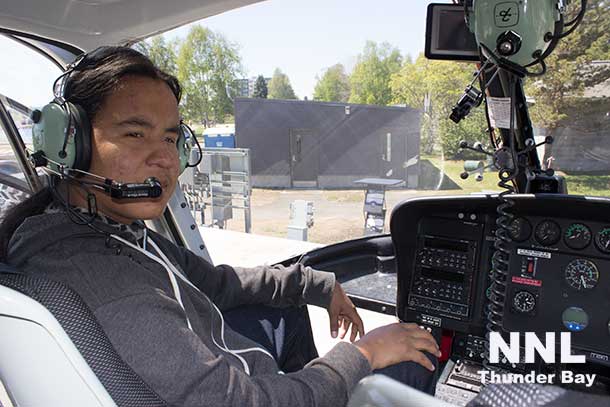 Ready for take-off or ready to take a picture? Munzeroy at the control of the Expedition Helicopter.