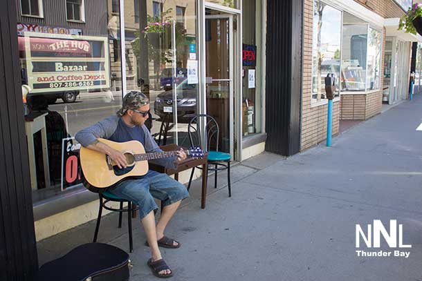 Morgan tuning up for Father's Day in the Fort William downtown neighbourhood.