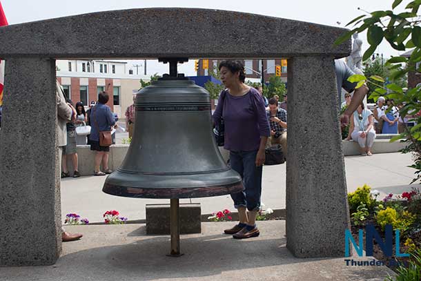 Ringing the Peace Bell during Ceremony at Thunder Bay City Hall