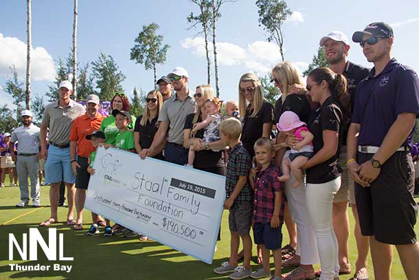 Cheque presentation on the 18th green at Whitewater Golf Club at the 2015 Staal Foundation Open presented by Tbaytel