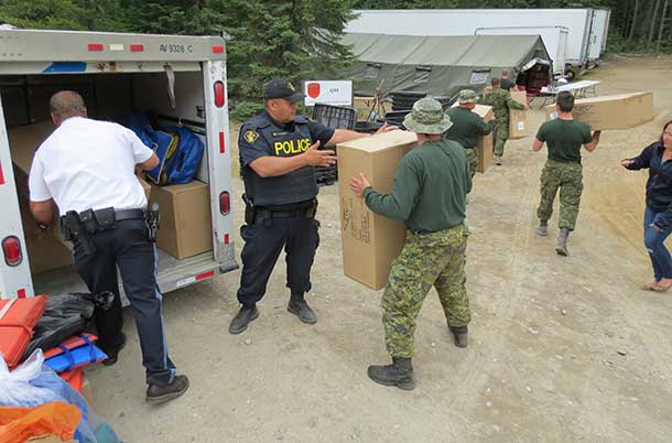 OPP Sergeant delivers 149 life jackets to Camp Loon.
