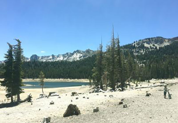 This image shows an abnormally low lake level at Horseshoe Lake in the high-elevation Mammoth Lakes Basin, Sierra Nevada Mountains, This photo was taken June 2015. Photo by Jennifer Bernstein