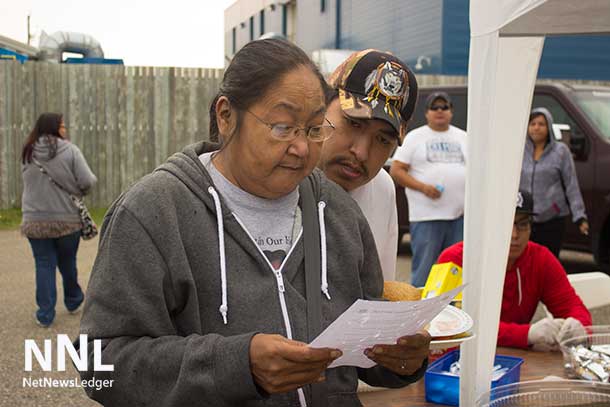 One of the Deer Lake members reading the letter telling of the new dialysis machine for Deer Lake First Nation