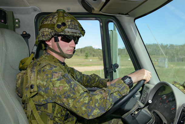 Private Alex Desjardins behind the wheel of a Medium Support Vehicle System (MSVS).