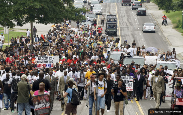 (Reuters) Protestors took to the streets marking the one year anniversary of the shooting of an unarmed black teenager