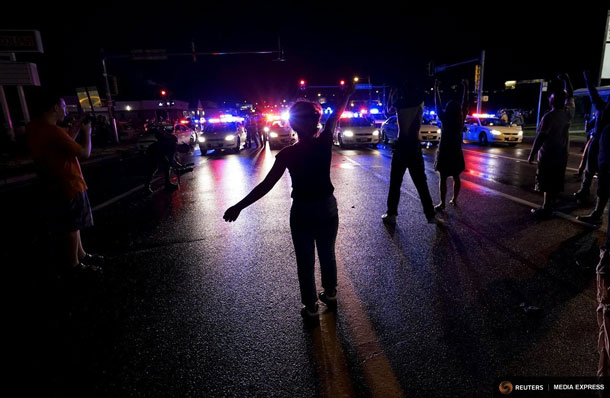 Reuters - Residents in Ferguson Rally on the one year anniversary of the shooting of an unarmed black man
