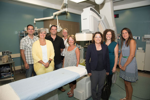 Members of the Organizing Committee of the Balmoral Park Acura Save a Heart Ball recently toured the Cath Labs at Thunder Bay Regional Health Sciences Centre. Funds from this year’s Ball, which is celebrating its 10th Anniversary, will go to the Northern Cardiac Fund to support the replacement of one C-arm in the cath lab, at a cost of $1.4 million. Pictured are (from left): Sean Davies (Co-Chair), Cherie Kok, Vince Mirabelli (Co-Chair), Tina Kaethler, Janis Beebe, Maria Vasanelli, Maureen Mills and Elena Quaresima. Photo Credit: Alan Dickson