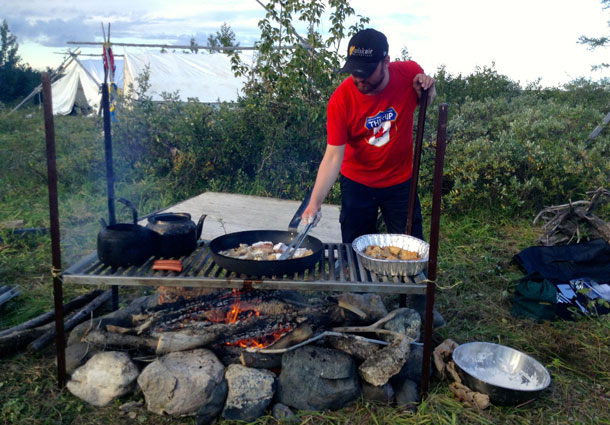 Volunteer Steve Berry fries up some fresh whitefish