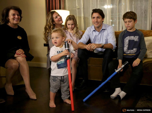 Liberal leader Justin Trudeau is accompanied by his mother Margaret Trudeau (L) and his wife Sophie Gregoire, daughter Ella Grace and sons Hadrien (foreground) and Xavier (R) as he watches results at his election night headquarters in Montreal, Quebec, October 19, 2015. REUTERS/Chris Wattie