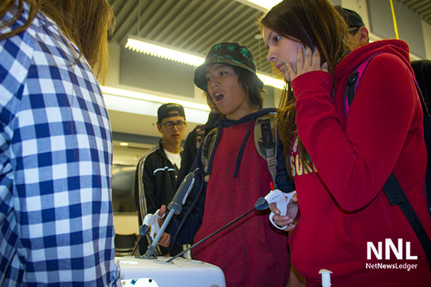 Testing their steady hands, young people from Limbrick neighbourhood get to test themselves at NOSM at Lakehead University.