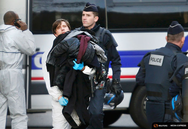 Abandoned clothes of victims are out of the Bataclan concert hall the morning after a series of deadly attacks in Paris, November 14, 2015.      REUTERS/Charles Platiau