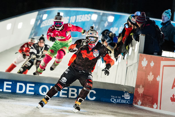 Cameron Naasz of the United States leads ahead of Dean Moriarity of Canada, Scott Croxall of Canada and Dylan Moriarity of Canada during the finals of the first stage of the Ice Cross Downhill World Championship at the Red Bull Crashed Ice in Quebec City, Canada on November 28, 2015.