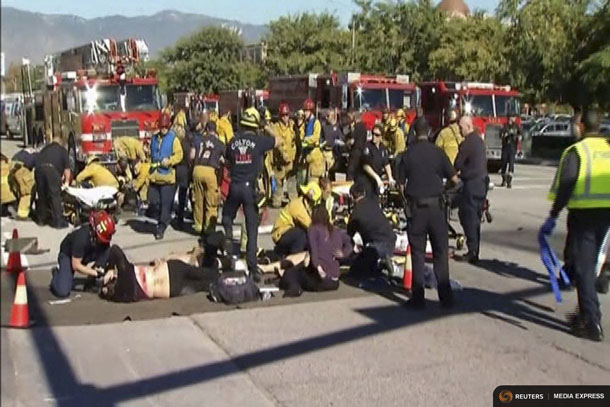 Rescue crews tend to the injured in the intersection outside the Inland Regional Center in San Bernardino, California in this still image taken from video December 2, 2015. REUTERS/NBCLA.com/Handout via Reuters