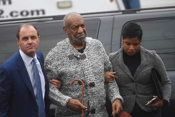 Actor and comedian Bill Cosby (C) arrives with attorney Monique Pressley (R) for his arraignment on sexual assault charges at the Montgomery County Courthouse in Elkins Park, Pennsylvania December 30, 2015. REUTERS/Mark Makela