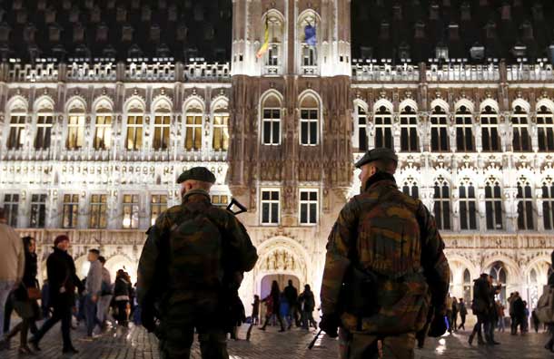 Belgian soldiers patrol along 