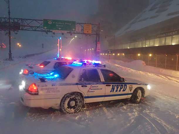 New York City police monitor traffic during a heavy snowstorm, in New York January 23, 2016. REUTERS/New York City Police Department/Handout via Reuters
