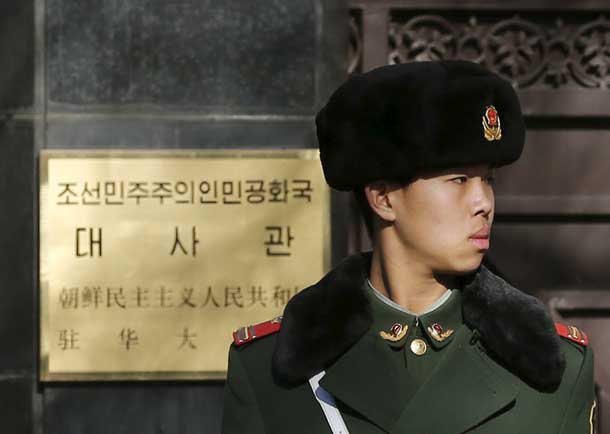 A paramilitary solider stands guard at the main gate of North Korea's embassy in Beijing January 6, 2016. North Korea said it had successfully conducted a test of a miniaturised hydrogen nuclear device on Wednesday morning. REUTERS/Kim Kyung-Hoon