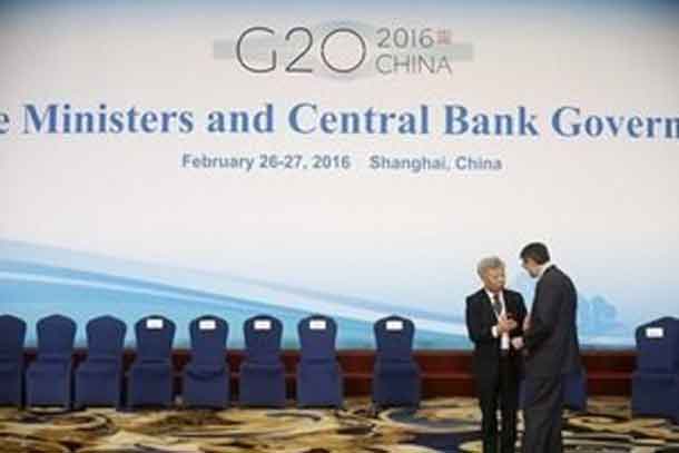 President of Asian Infrastructure Investment Bank (AIIB) Jin Liqun (L) and U.S. Secretary of the Treasury Jack Lew talk as they attend a group photo session during the G20 finance ministers and central bank governors meeting in Shanghai, China February 27, 2016. REUTERS/Aly Song