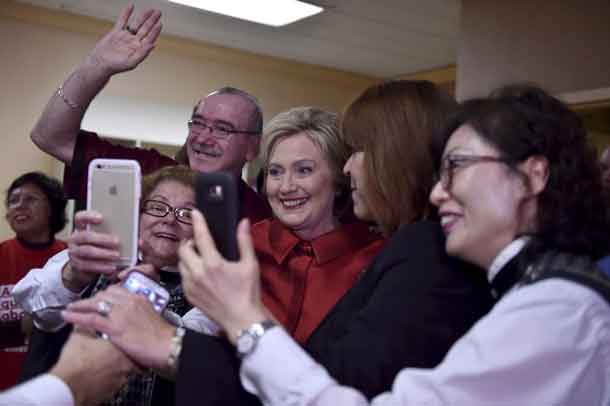 Hillary Clinton meets employees during a campaign stop on caucus day at Harrah's Las Vegas in Las Vegas, Nevada February 20, 2016. REUTERS/David Becker