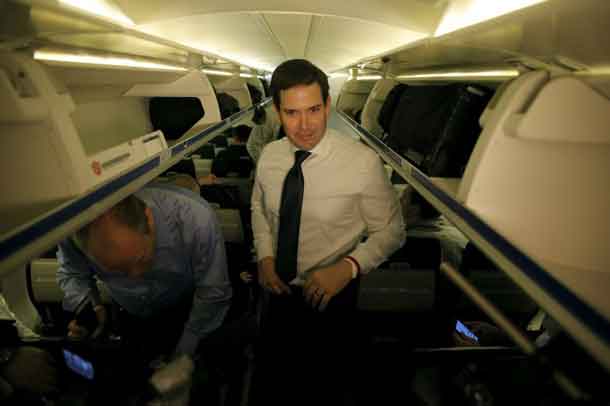 U.S. Republican presidential candidate Marco Rubio pauses before speaking with the media on his campaign plane before departing from West Columbia, South Carolina February 20, 2016. REUTERS/Chris Keane