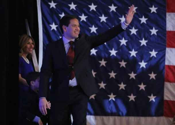 Republican U.S. presidential candidate Senator Marco Rubio waves to supporters as he takes the stage before speaking at the Rubio caucus watch party at the Downtown Marriott Hotel in Des Moines, Iowa February 1, 2016. REUTERS/Aaron P. Bernstein