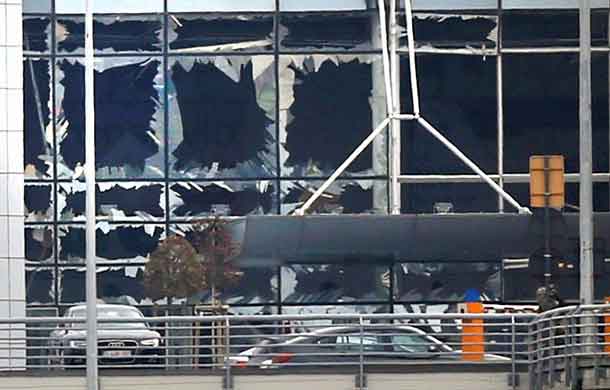 Broken windows seen at the scene of explosions at Zaventem airport near Brussels, Belgium, March 22, 2016. REUTERS/Francois Lenoir