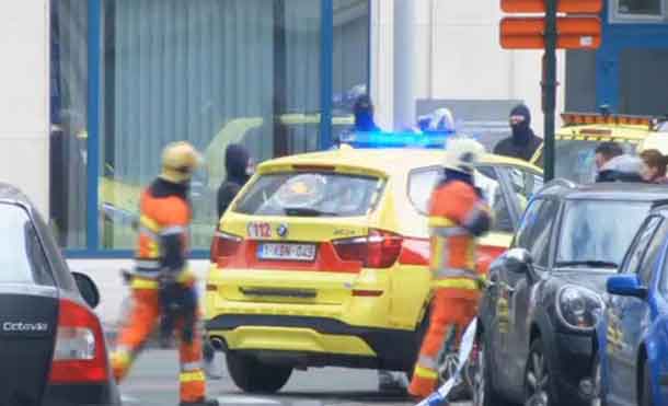 Emergency personnel are seen at the scene of a blast outside a metro station in Brussels, in this still image taken from video on March 22, 2016. REUTERS/Reuters TV