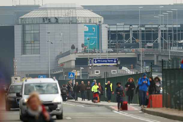 People leave the scene of explosions at Zaventem airport near Brussels, Belgium, March 22, 2016. REUTERS/Francois Lenoir