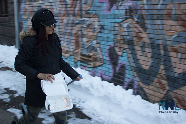 Layla helps in the laneway off Victoria Avenue East in the VCC Clean up effort.