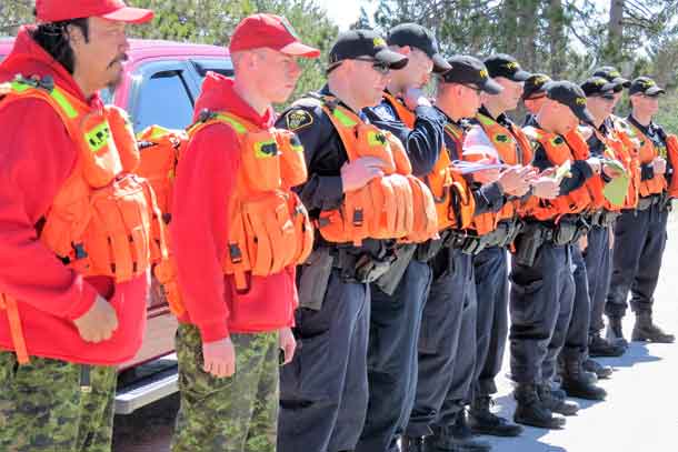 Master Corporal Isaac Barkman and Ranger Christian Caie parade with other search and rescue students on police course.