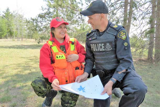 Ranger Jocelyn Yellowhead of Neskantaga with OPP Sergeant Jamie Stirling during a search and rescue training course at Canadian Forces Base Borden