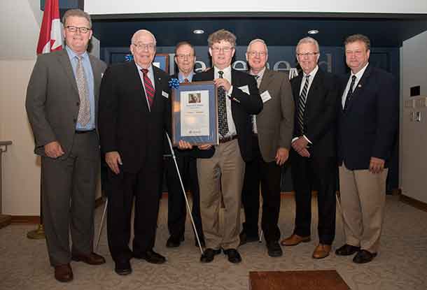 From left, Tobias Fisher; Chancellor Derek Burney; Matthew Fisher; John Fisher; Mark Fisher; Gordon Fisher, President of The National Post; and Dr. Brian Stevenson, Lakehead University’s President and Vice-Chancellor participated in an event to honour the late Doug Fisher.