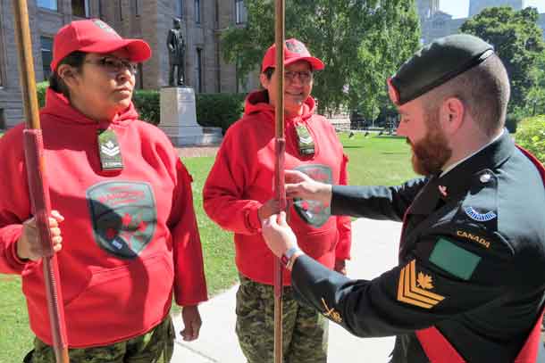 Sergeant Ben Kirke gives last minute instructions to Master Corporal Denise Ningewance and Corporal Rita Brisket before they go on parade.