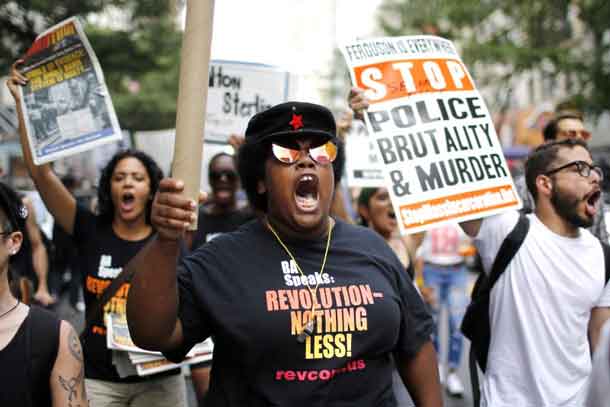 People take part in a protest for the killing of Alton Sterling and Philando Castilein during a march along Manhattan's streets in New York July 7, 2016. REUTERS/Eduardo Munoz