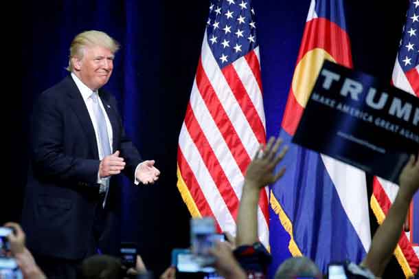 Republican presidential nominee Donald Trump walks on stage at a campaign rally in Colorado Springs, Colorado, U.S., July 29, 2016. REUTERS/Carlo Allegri