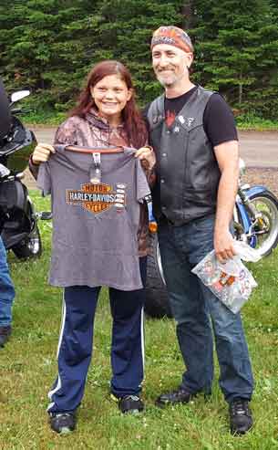 Kaia receiving a Harley T-Shirt