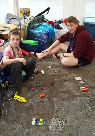 Owen and his companion Scott building a toy car city