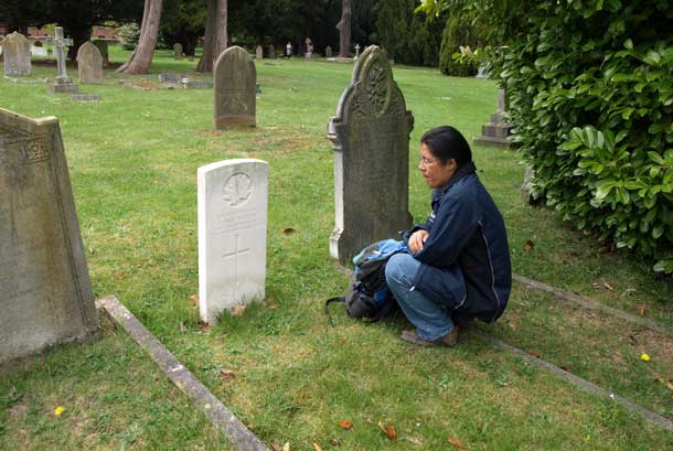 John Chookomolin's final resting place is in St Jude's Cemetery in Englefield Green, UK. Here we see Xavier Kataquapit at the grave of his great grandfather during his visit to England in 2011.