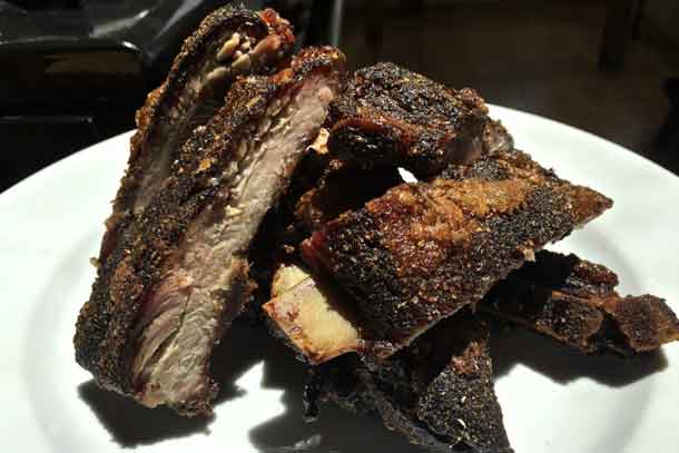 Dry rub pork ribs cut apart after slow roasting and ready for serving. Credit: Copyright 2016 David Latt