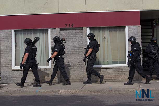 Members of the Thunder Bay Police Service Tactical Unit leaving the incident scene at 17:04EDT