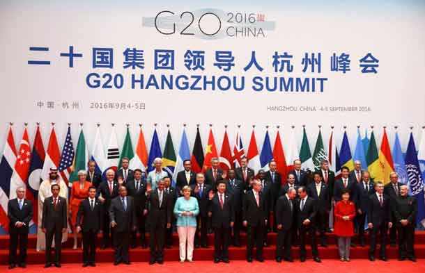 Leaders, including Britain's Prime Minister Theresa May (2nd row, 2nd L), pose for pictures during the G20 Summit in Hangzhou, Zhejiang province, China September 4, 2016. REUTERS/Damir Sagolj/File Photo